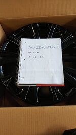 Mazda Wheel with sign.jpg