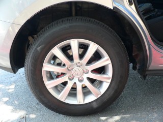 2010-mazda-cx-7--base-wheels-are-a-similar-style-but-dont-fill-wheelwells-quite-as-well_100227744_s.jpg